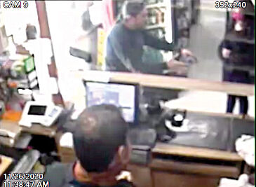 Tim Lopez explaining shooting to a customer